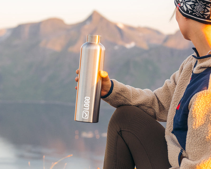 Stainless steel water bottle with an engraved company logo